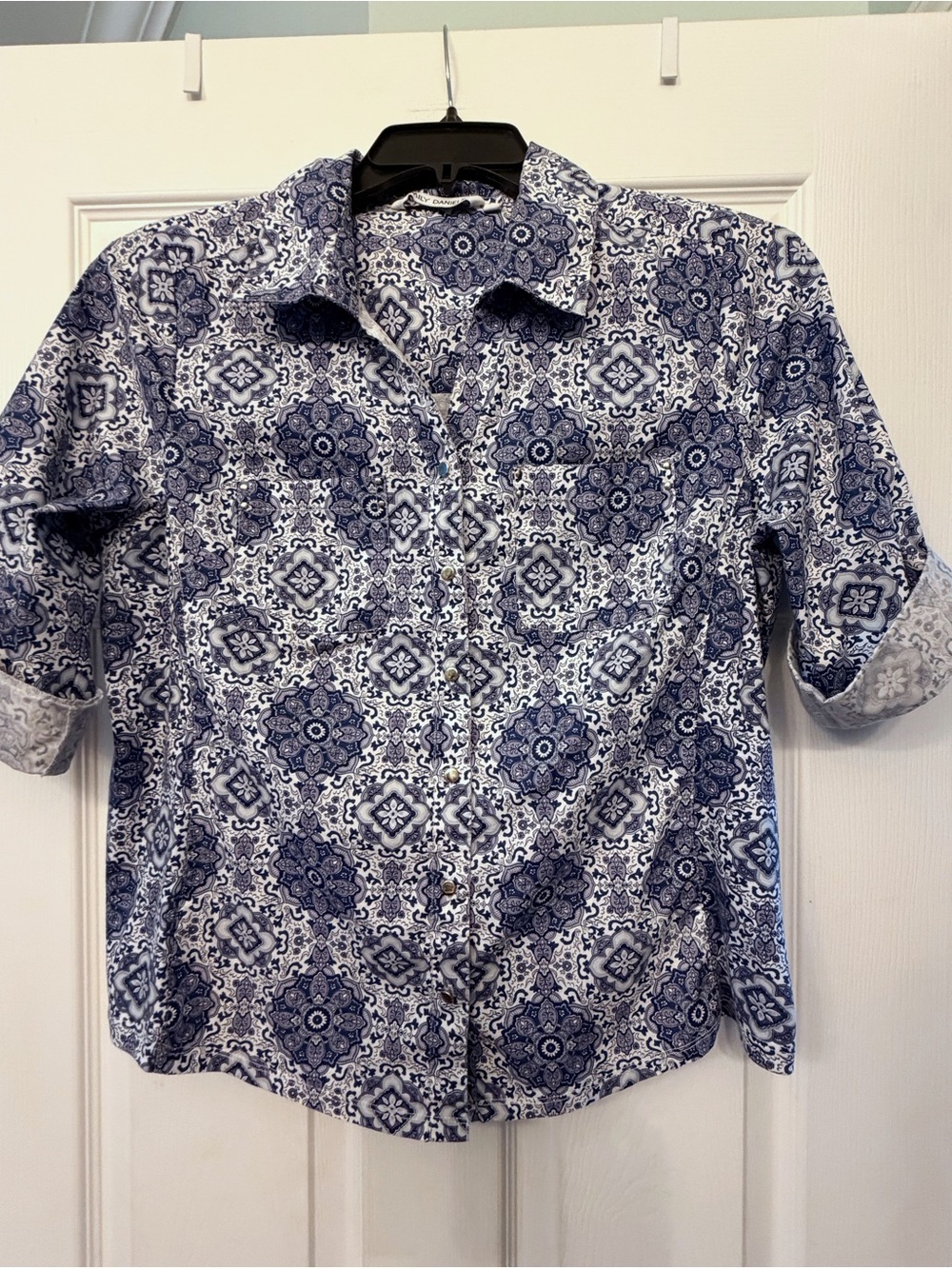 Emily Daniels, blue and white button down shirt